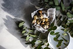 Easter table setting with eggs and eucalyptus