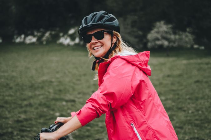 Smiling female riding bicycle