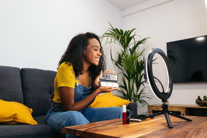 Beauty blogger promoting makeup on social media