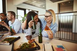 Group of professionals enjoying lunch party at work
