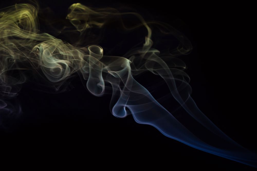 Abstract smoke moving on dark background