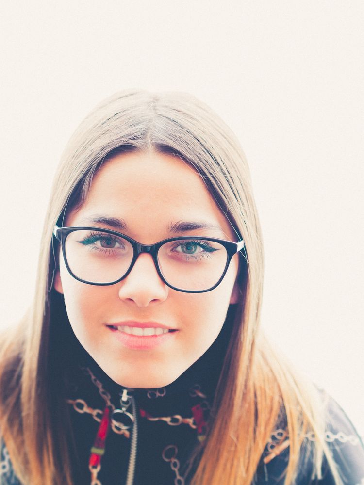 young woman in eyeglasses