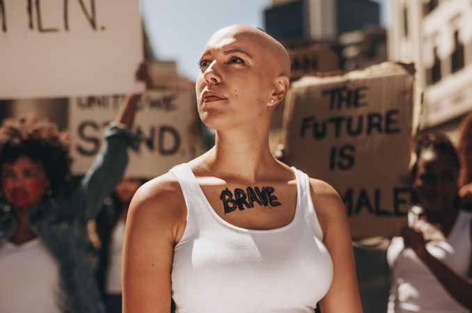 Woman with word brave written on her body