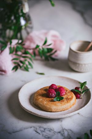 Pancake with fresh raspberry on plate