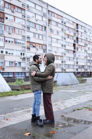 Happy white couple holding each other