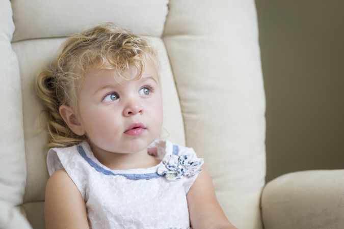 Blue Eyed Little Girl in Chair