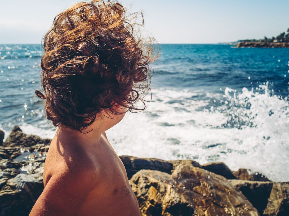 anonymous little girl by the beach