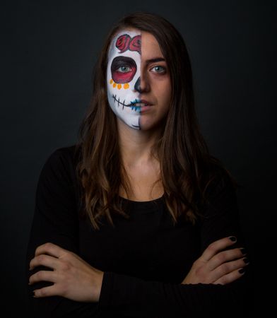 Young woman with creepy face paint