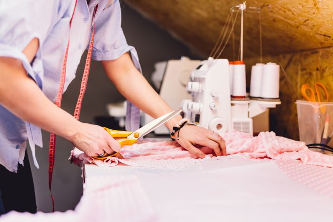 Crop hand cutting fabric