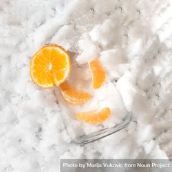 Glass with oranges on sliver icy background 4A7wz0