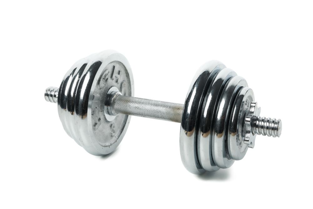 Dumbbell isolated on light background. Healthy lifestyle
