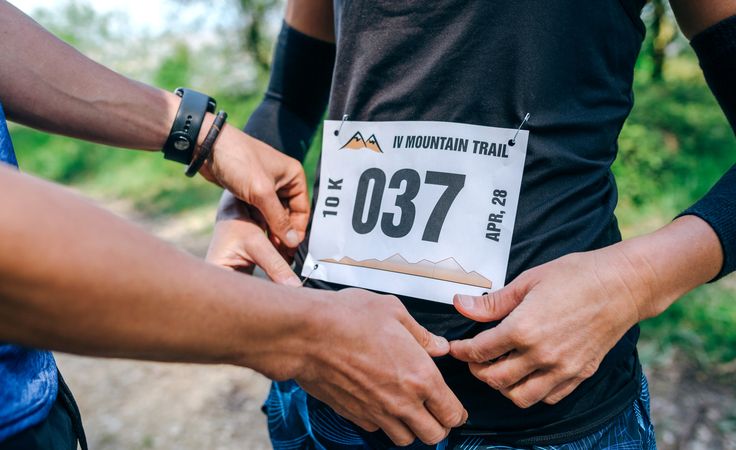 Person placing the race number