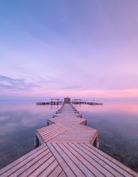 Wooden pier on cloudy evening
