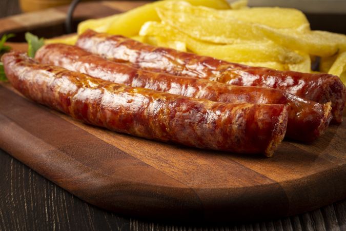 Grilled German sausage with french fries.