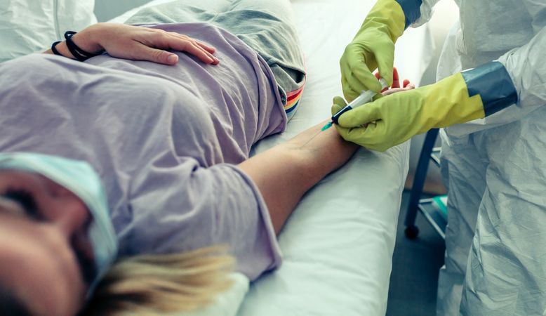 Doctor doing a blood test to a patient