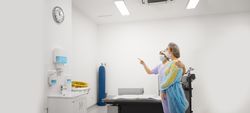 Wide view of patient just out of surgery with doctor