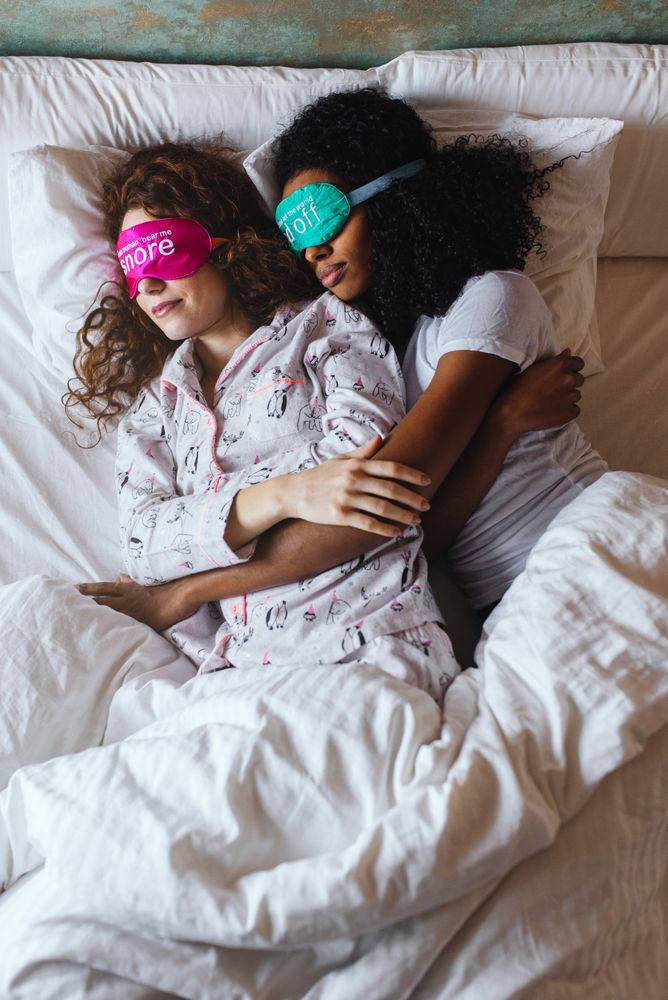 Women relaxed sleeping in bed with blindfold at home