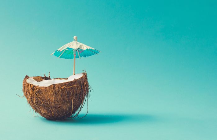 Coconut half with parasol