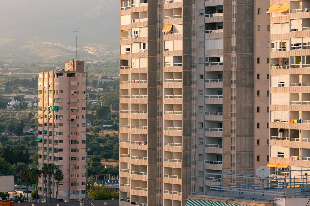 Residential buildings against sunset sky