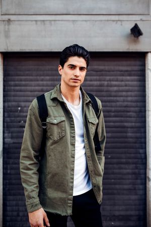 Young man in casual clothes standing outdoors