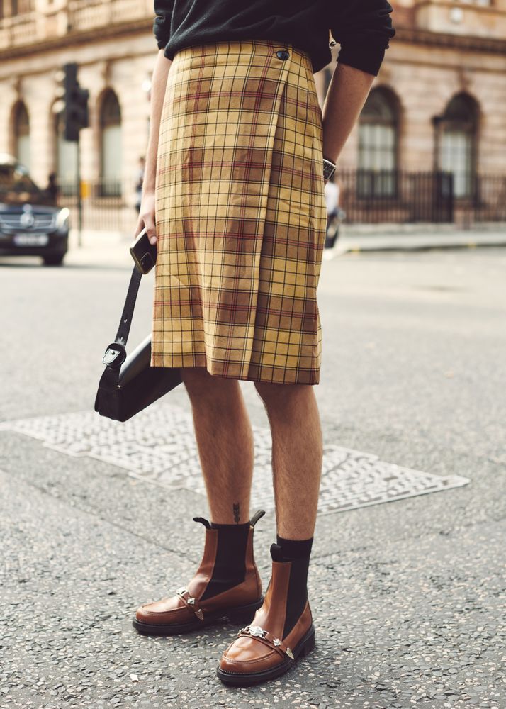 London, England, United Kingdom - September 18 2021: Bottom half of a person wearing a plaid skirt