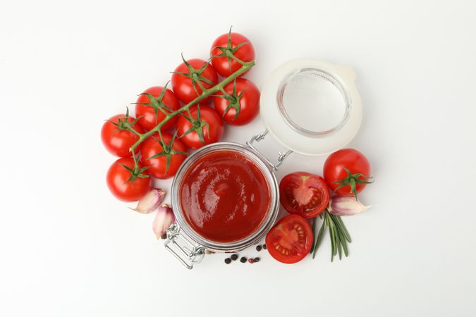 Tomatoes, sauce and ingredients isolated on neutral background
