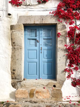 Patmian blue door with red Bougainvillea