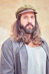 Brutal hipster man looking at camera