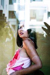 stylish woman looking through window