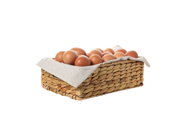 eggs in a square basket, isolated on blank background.