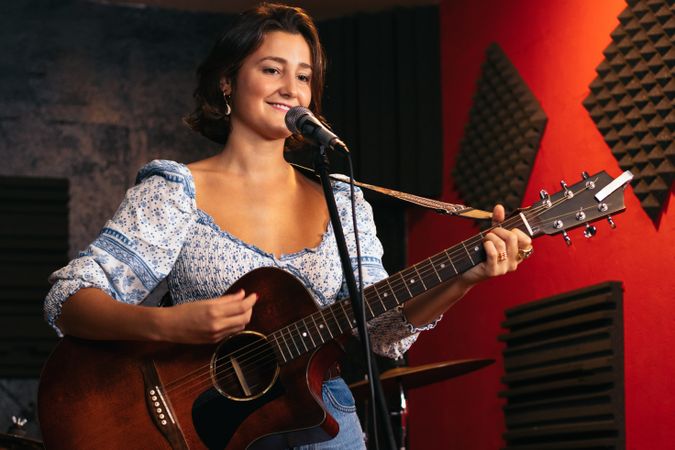 Close-up of a female singer and guitarist rehearsing their songs