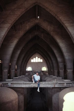 Unrecognizable man in old cathedral