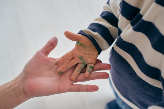 Little boy showing dirty hand