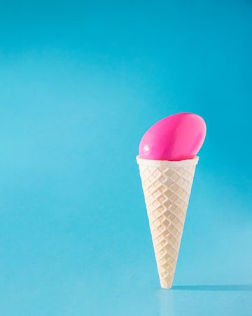 Ice cream cone with pink egg