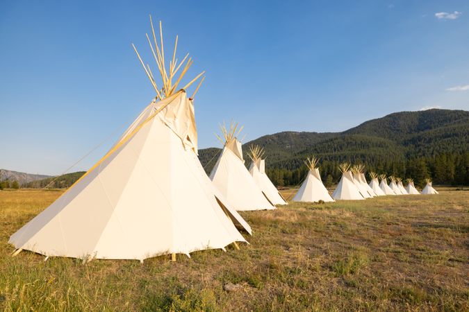 Montana, United States - August 17, 2022: Line of teepee in the rockies in summer