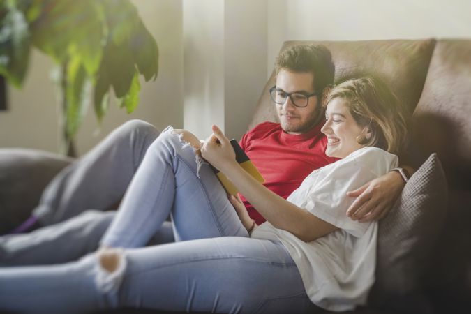 Dreamy couple with brochure