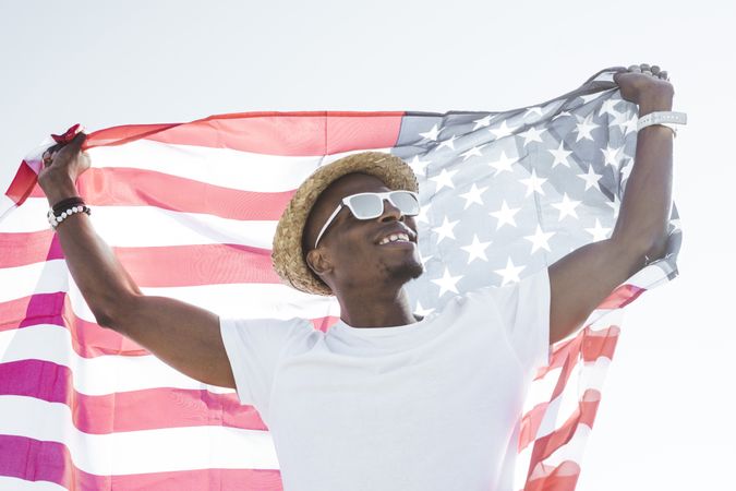 Cheerful black man with American flag