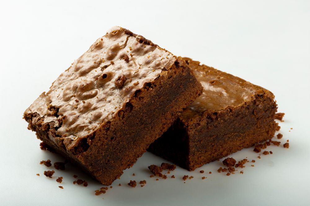 Two freshly made chocolate brownies