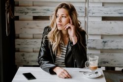 Woman using smartphone at table