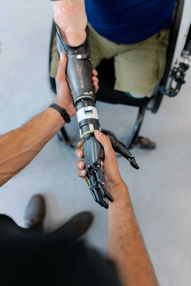 Top view of two people handshaking