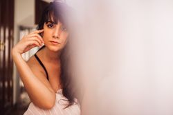 Sensual woman in lingerie in modern flat