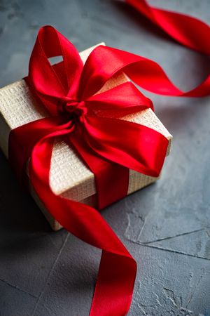 Gift box concept with red ribbon