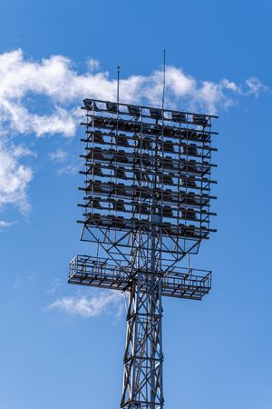 Stadium lights on the blue sky background