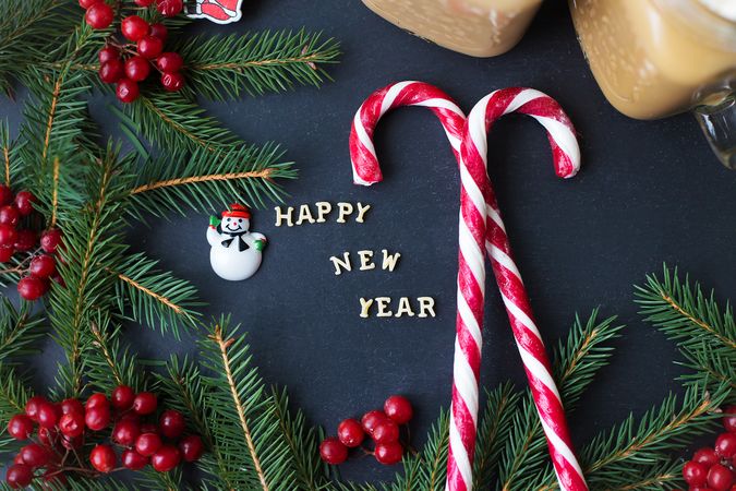 Christmas holiday background with hot cocoa and candy. The inscription Happy New Year