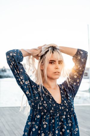 Woman looking at camera during sunrise