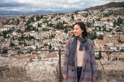 Cheerful woman visiting ancient city