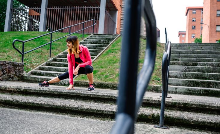 Female athlete doing stretching outdoors