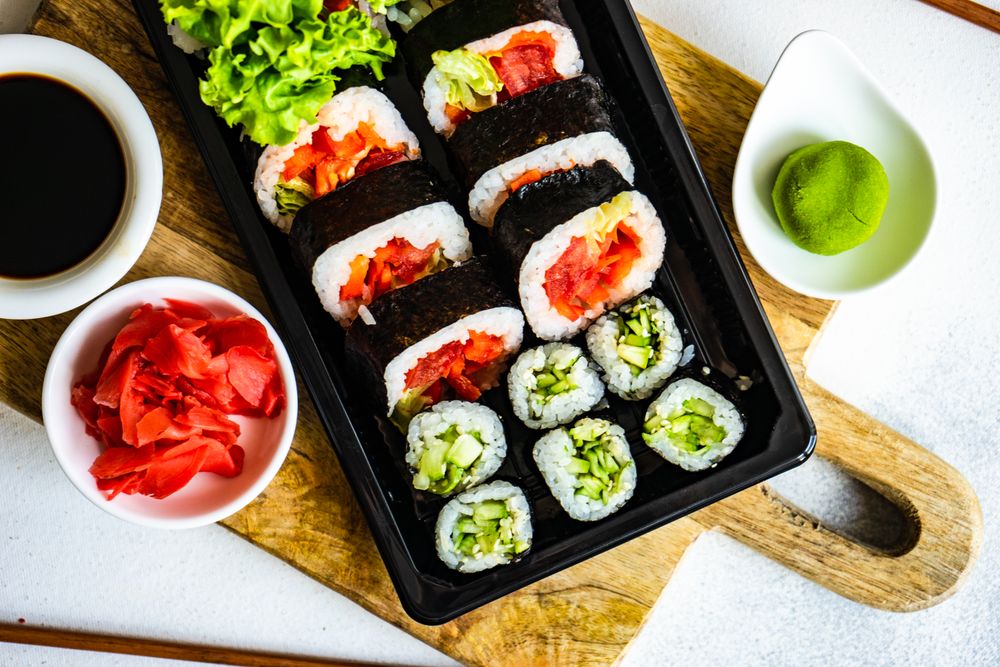 Top view of to go box of delicious sushi and sashimi