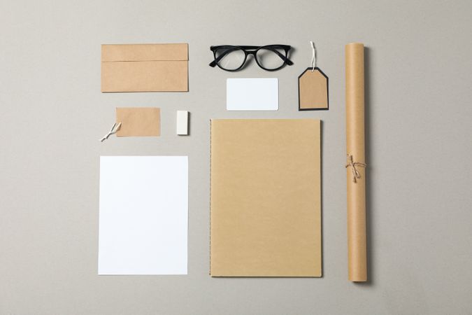 Mockup. Corporate stationery and glasses on grey background. Flat lay