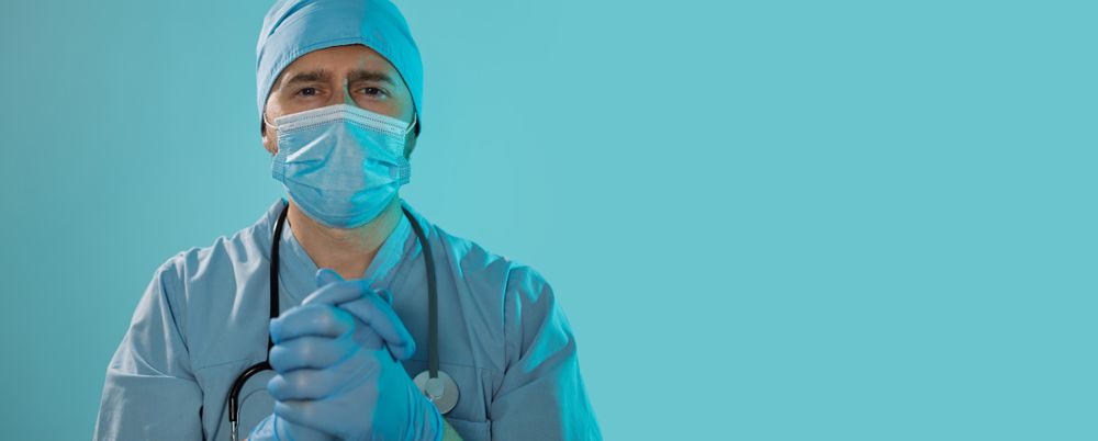 Doctor With Folded Hands Symbolizing Trust and Care